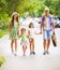 Happy young family walking with guitar spending carefree time to