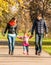 Happy young family walks in the park