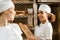 happy young female bakers working