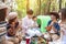 Happy young friends having picnic