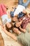 Happy young friends lying on carpet and taking selfie