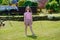 Happy young girl on the beach at Tighnabruaich in Argyll and Bute on the west coast of Scotland during the summer