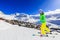 Happy young girl enjoying winter vacations in mountains, Val Thorens, 3 Valleys, France. Playing with snow and sun in high