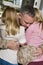 Happy young girl hugging her father in uniform