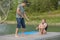 Happy young girl learning water ski