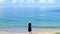 Happy young girl took photo or vdo of beautiful crystal clear blue sea water by mobile phone or smartphone