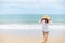 Happy young girl walking on the beach. Summer travel, vocation, holiday concept