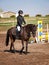 Happy young girl after winning on showjumping competition