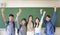 Happy young group of teenagers student having fun  in classroom