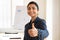 Happy young Indian business professional coach woman showing thumb up