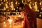 Happy young indian couple celebrating diwali festival both holding sparkler in hand and wearing traditional wear or ethnic outfit