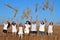 Happy young Israeli women throwing wheat to the air on Shavuot J