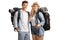 Happy young male and female backpackers