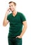 Happy young man in green casual clothing, talking on cellphone