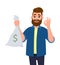 Happy young man is holding money, cash bag in hand and gesturing okay or OK or cool sign. Successful business and finance.