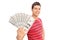 Happy young man holding a pile of cash