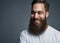 Happy young man with large fuzzy beard