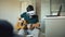 Happy young man sitting at kitchen learning to play guitar using VR 360 headset and feels him guitarist at concert at