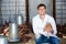 Happy young man veterinarian with chicken