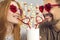 Happy young man and woman in love enjoying drink from one cup on a fun date on St Valentine`s Day