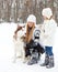 Happy young mother with daughter with huskies dog