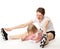 Happy young mother and her little daughter doing sport exercises