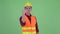 Happy young multi ethnic man construction worker with fist raised