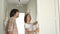 Happy young people celebrate housewarming. A guy and a girl, a young family are inspecting the lockers in their newly