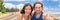 Happy young people doing thumbs up on summer travel vacation banner panorama. Smiling Asian woman and Caucasian couple