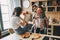 Happy young people having fun together, smiling, eating pizza an