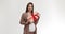 Happy young pregnant woman holding gift box, enjoying holiday celebration and presents