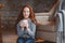 Happy young readhead woman drinking hot coffee or tea at home. Calm and cozy weekend in winter