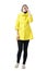 Happy young short hair woman in yellow coat laughing loudly on the mobile phone