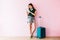 Happy Young Traveler Woman with Suitcase and Music Headphone using Tablet and Smiling, Full Length,Technology on