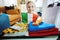 Happy young traveller child showing Italian Flag