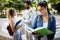 Happy young university students studying together. Group of multiracial friends in college