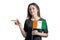 Happy young white woman holding flag Cote d`Ivoire and points to the left isolated on a white background