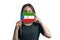 Happy young white woman holding flag Equatorial Guinea flag and covers her face with it isolated on a white background