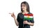 Happy young white woman holding flag Kurdistan and points to the left isolated on a white background