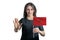 Happy young white woman holding flag of Morocco and with a serious face shows a hand stop sign isolated on a white