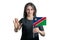 Happy young white woman holding flag of Namibia and with a serious face shows a hand stop sign isolated on a white background