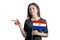 Happy young white woman holding flag Paraguay and points to the left isolated on a white background