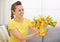 Happy young woman with bouquet of tulips in bucket