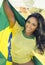 Happy young woman in Brazil football top