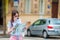 Happy young woman with a city map in Europe. Travel tourist woman with map in Prague outdoors during holidays in Europe.