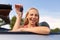 Happy young woman with convertible car key