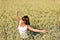 Happy young woman in corn field enjoy sunset