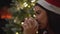Happy young woman drinking tea cup during Christmas holidays
