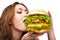 Happy Young Woman Eating big yummy Burger isolated