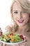 Happy Young Woman Eating Colourful Garden Salad